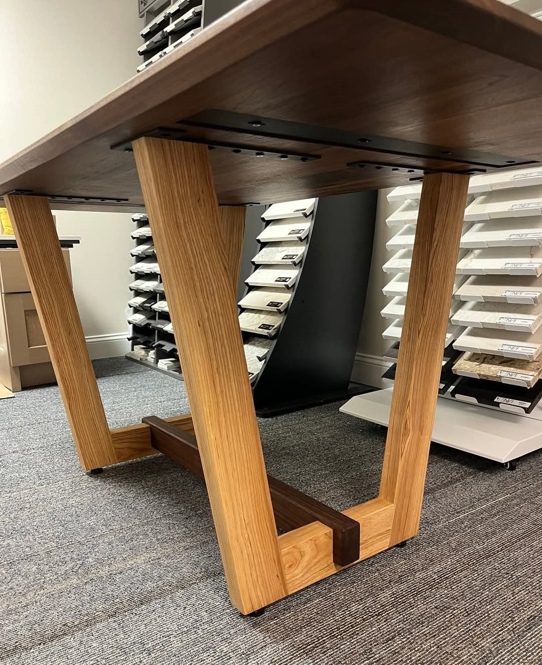 Walnut and ash conference table branded with business logo