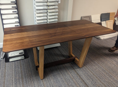 Walnut and ash conference table branded for business logo
